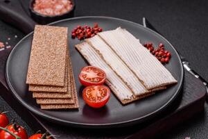 Rectangular whole grain crisp bread with cream cheese photo
