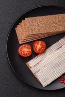Rectangular whole grain crisp bread with cream cheese photo