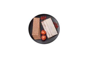 Rectangular whole grain crisp bread with cream cheese photo