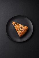Pieces of quiche with salmon, spinach or broccoli, salt and spices photo