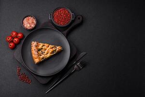 Pieces of quiche with salmon, spinach or broccoli, salt and spices photo