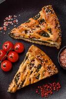 Pieces of quiche with salmon, spinach or broccoli, salt and spices photo
