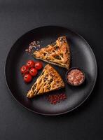 Pieces of quiche with salmon, spinach or broccoli, salt and spices photo