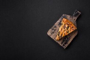 Pieces of quiche with salmon, spinach or broccoli, salt and spices photo
