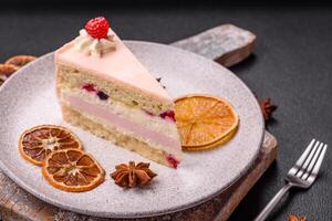 Piece of sweet cake with pink cream with raspberry flavor, with shortbread, cheesecake photo