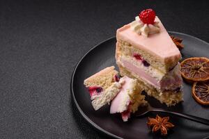 Piece of sweet cake with pink cream with raspberry flavor, with shortbread, cheesecake photo