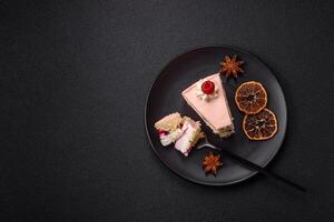 Piece of sweet cake with pink cream with raspberry flavor, with shortbread, cheesecake photo