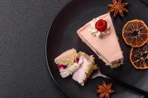 Piece of sweet cake with pink cream with raspberry flavor, with shortbread, cheesecake photo