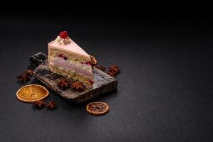 Piece of sweet cake with pink cream with raspberry flavor, with shortbread, cheesecake photo