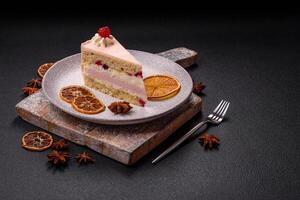 Piece of sweet cake with pink cream with raspberry flavor, with shortbread, cheesecake photo