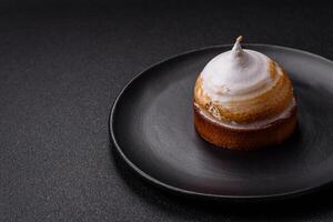 Sweet lemon tart with cream filling and zest photo