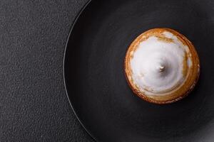 Sweet lemon tart with cream filling and zest photo