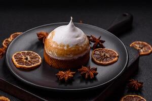 Sweet lemon tart with cream filling and zest photo