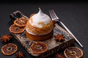 Sweet lemon tart with cream filling and zest photo