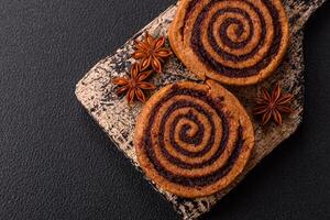 Freshly baked cinnamon roll with spices and cocoa filling photo
