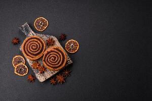 Freshly baked cinnamon roll with spices and cocoa filling photo