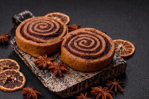 Freshly baked cinnamon roll with spices and cocoa filling photo