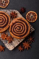 Freshly baked cinnamon roll with spices and cocoa filling photo