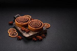 Freshly baked cinnamon roll with spices and cocoa filling photo