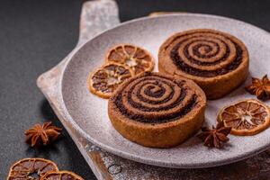 Freshly baked cinnamon roll with spices and cocoa filling photo