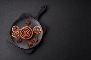 Freshly baked cinnamon roll with spices and cocoa filling photo