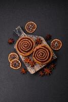 Freshly baked cinnamon roll with spices and cocoa filling photo