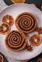 Freshly baked cinnamon roll with spices and cocoa filling photo
