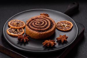 Freshly baked cinnamon roll with spices and cocoa filling photo