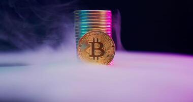 Bitcoin in smoke on a table with colorful smoke video