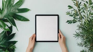 Black tablet computer with a blank screen, isolated on a white background for product showcasing. photo