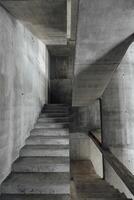 staircase space with concrete walls during building photo