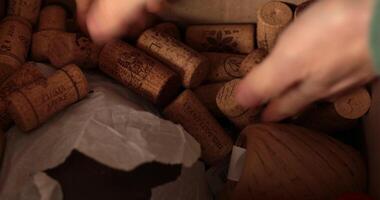 Hands show DIY crafting materials as paper rope and wine corks. Explore creative ways to enhance your Christmas celebrations through fun DIY projects. video