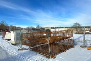 Reinforcement structures on a snow-covered construction site. photo
