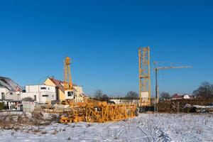 Beginning of assembling a construction crane on a construction site. photo