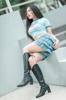 A woman sitting on a ledge photo