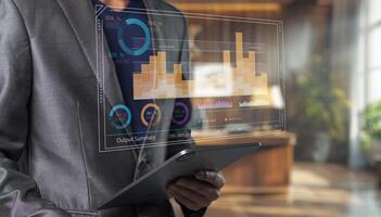 Businessman using tablet with data chart photo