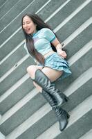 A woman sitting on some steps photo
