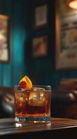 Classic Old Fashioned Cocktail in a Dimly Lit Cozy Bar Setting photo