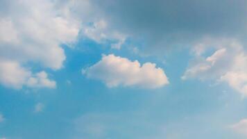 A plane flying in the sky with clouds photo