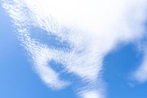 Low angle view and full frame of beautiful blue sky with strange shape of clouds in the morning or evening in sunny day used as natural background texture in decorative art work photo