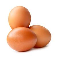 Side view of three brown chicken eggs in stack isolated on white background with clipping path photo