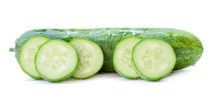 Side view of fresh green cucumber with slices in circle shape in stack isolated on white background with clipping path photo