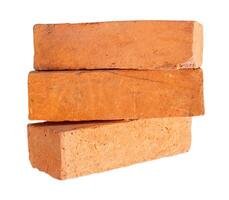 Side view of old red or orange bricks in stack isolated on white background with clipping path photo