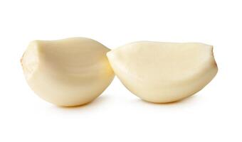 Side view of peeled garlic cloves in stack isolated on white background with clipping path photo