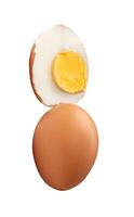 Top view of boiled or cooked brown chicken eggs with half and egg yolk in stack isolated on white background with clipping path photo