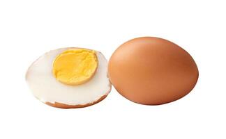 Side view of boiled or cooked brown chicken eggs with half and egg yolk in stack isolated on white background with clipping path photo