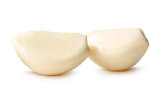Side view of peeled garlic cloves in stack isolated on white background with clipping path photo