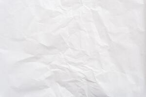 Top view and full frame of wrinkled or crumpled white stencil paper texture used for wrinkled or crumpled white paper background texture in decorative art work photo