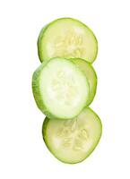 Top view of green cucumber slices or pieces in stack isolated on white background with clipping path photo