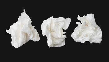 Top view set of screwed or crumpled white tissue paper ball isolated on black background with clipping path photo